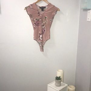 A great condition bodysuit with flowers.